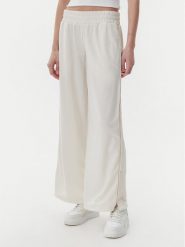 Puma Spodnie dresowe Ess 629804 Beżowy Wide Leg. Brązowe spodnie dresowe Puma, xl, bez wzorów, z dresówki. Za 179.99 zł.