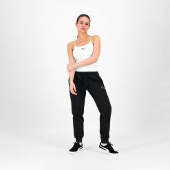Spodnie dresowe damskie Puma Gym & Pilates. Czarne spodnie dresowe Puma, l, bez wzorów, z bawełny. W wyprzedaży za 79.99 zł.