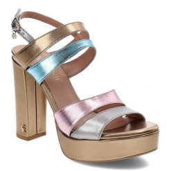 Złote Sandały Carinii Eleganckie Skórzane Buty. Żółte sandały Carinii, z aplikacjami, ze skóry, eleganckie, bez obcasa, na obcasie, bez zapięcia. Za 375.00 zł.