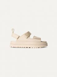 UGG Sandały "Goldenglow" w kolorze kremowym rozmiar: 37. Brązowe sandały UGG, bez wzorów, z otwartym noskiem, bez obcasa, na koturnie, bez zapięcia. Za 440.28 zł.