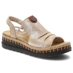 Sandały damskie Rieker, cholewka ze skóry ekologicznej z metalicznym wykończeniem wsuwany fason z elastycznymi wstawkami, beżowe, V7972-60. Brązowe sandały Rieker, bez wzorów, ze skóry ekologicznej, eleganckie, bez obcasa, na koturnie, bez zapięcia. Za 319.00 zł.