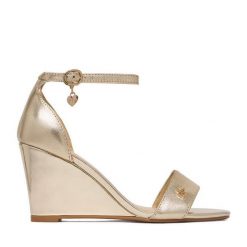 Sandały MEXX. Żółte sandały Mexx, bez wzorów, bez obcasa, na koturnie, bez zapięcia. Za 299.99 zł.