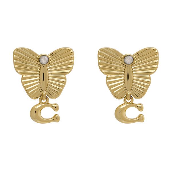 Kolczyki Coach. Żółte kolczyki Coach, złote. Za 329.99 zł.