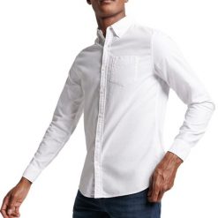 Koszula z długim rękawem z bawełny organicznej Superdry Oxford. Białe koszule Superdry, xl, bez wzorów, z bawełny, casualowe, bez kołnierzyka, bez ramiączek. Za 275.40 zł.