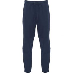 Spodnie Do Biegania Dla Dorosłych Unisex Neapolis. Niebieskie spodnie sportowe ROLY, bez wzorów, do biegania. Za 100.99 zł.