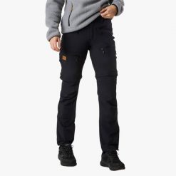 Spodnie Wędrówki damska Swedemount Lofoten Stretch Zip-Off Pants wodoodporna. Czarne spodnie sportowe SWEDEMOUNT, bez wzorów, z tkaniny, trekkingowe. Za 449.99 zł.