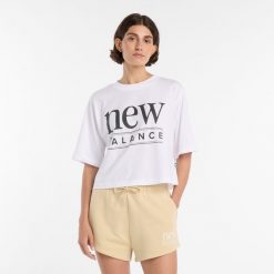 Koszulka damska New Balance WT61V5OPWT – biała. Białe bluzki New Balance, l, bez wzorów, z bawełny, bez kołnierzyka, bez ramiączek. Za 149.99 zł.