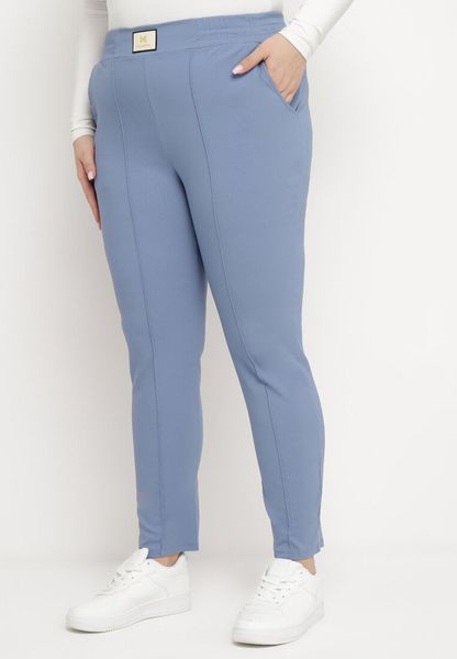 Niebieskie Spodnie z Wysokim Stanem i Gumką w Pasie Geminia. Niebieskie spodnie materiałowe Born2be, na co dzień, uniwersalny, bez wzorów, z gumy, z podwyższonym stanem. Za 39.99 zł.