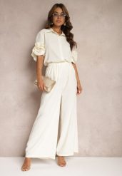 Beżowy Komplet Szerokie Spodnie i Koszula z Falbanami Rivathins. Brązowe koszule Renee, l, bez wzorów, eleganckie, bez kołnierzyka, bez ramiączek. W wyprzedaży za 159.99 zł.