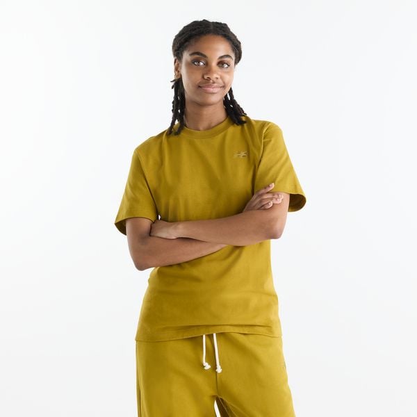 Koszulka damska New Balance WT41501BIL – żółta. Żółte bluzki New Balance, s, bez wzorów, z materiału, eleganckie, bez kołnierzyka, bez ramiączek. Za 179.99 zł.