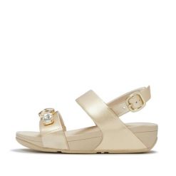 Damskie sandały na koturnie FitFlop Lulu Ultra-Jewel Metallic. Szare sandały FIT FLOP, bez wzorów, z materiału, eleganckie, bez obcasa, na koturnie, bez zapięcia. Za 715.50 zł.