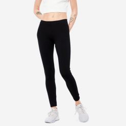 Legginsy fitness damskie Nyamba 100 Salto. Czarne legginsy DOMYOS, plus size, bez wzorów, z bawełny. Za 29.99 zł.