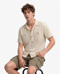 Superdry Koszula krótki rękaw The Merchant Store z fakturowanej bawełny. Brązowe koszule Superdry, m, bez wzorów, z bawełny, eleganckie, bez kołnierzyka, bez ramiączek. Za 335.65 zł.