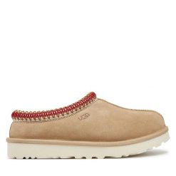 Kapcie Ugg. Brązowe obuwie domowe UGG, bez wzorów, bez zapięcia. Za 559.99 zł.