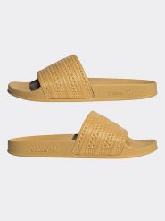 Adidas Klapki w kolorze żółtym rozmiar: 42. Żółte klapki Adidas, bez wzorów, z otwartym noskiem, bez obcasa. Za 154.07 zł.