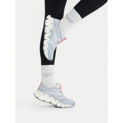 Buty do biegania Reebok. Niebieskie obuwie sportowe Reebok, bez zapięcia, do biegania. Za 489.99 zł.