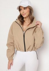 Ciemnobeżowa Kurtka Wiatrówka o Kroju Oversize Natilessa. Brązowe kurtki sportowe Born2be, na wiosnę, l, bez wzorów, z jeansu, trekkingowe. Za 179.99 zł.