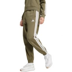 Spodnie damskie adidas Essentials 3-Stripes Fleece Loose-Fit. Zielone spodnie materiałowe Adidas, na co dzień, bez wzorów, z bawełny. Za 171.99 zł.
