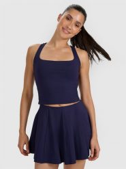 4F Crop-top tenisowy szybkoschnący damski - granatowy L. Niebieskie koszulki sportowe 4f, bez wzorów, z elastanu, bez ramiączek, tenisowe. Za 129.99 zł.
