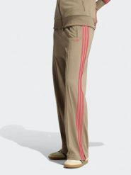 Adidas Spodnie dresowe w kolorze beżowym rozmiar: XL. Brązowe spodnie dresowe Adidas, xl, bez wzorów, z dresówki. Za 204.95 zł.