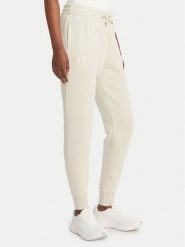 Under Armour Spodnie dresowe UA Icon Fleece 6001537 Beżowy Slim Fit. Brązowe spodnie sportowe Under Armour, xl, bez wzorów, z bawełny. Za 249.99 zł.