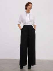 BGN Spodnie w kolorze czarnym rozmiar: 34. Czarne spodnie materiałowe BGN, na co dzień, bez wzorów, z materiału. Za 100.99 zł.