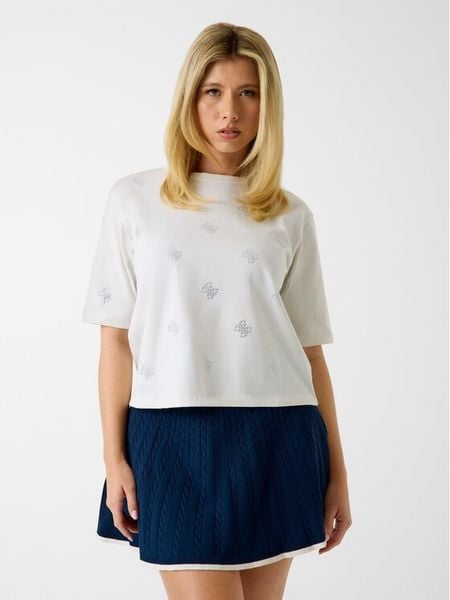 Guess T-Shirt V6GI18 K2985 Kremowy Regular Fit. Białe t-shirty Guess, xs, z aplikacjami, z bawełny, bez kołnierzyka, bez ramiączek. Za 132.99 zł.