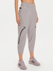 Under Armour Spodnie outdoor UA Unstoppable 1382741 Beżowy Loose Fit. Brązowe spodnie sportowe Under Armour, s, bez wzorów, z syntetyku, outdoorowe. Za 249.99 zł.