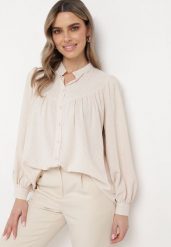 Jasnobeżowa Koszula ze Stójką z Lekko Bufiastymi Rękawami Himastia. Brązowe koszule Born2be, l, bez wzorów, z jeansu, eleganckie, bez kołnierzyka, bez ramiączek. Za 129.99 zł.