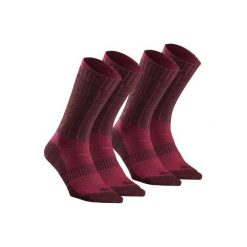 Skarpety turystyczne SH500 ultra-warm mid. Czerwone skarpety QUECHUA, bez wzorów, z elastanu. Za 49.99 zł.