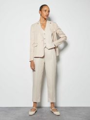 Someday Spodnie w kolorze kremowym rozmiar: 40. Brązowe spodnie materiałowe someday., na co dzień, bez wzorów, z materiału. Za 260.95 zł.