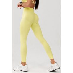 Damskie legginsy bezszwowe Rough Radical Seamless Glow Long. Żółte bielizna sportowa ROUGH RADICAL, bez wzorów. W wyprzedaży za 127.92 zł.
