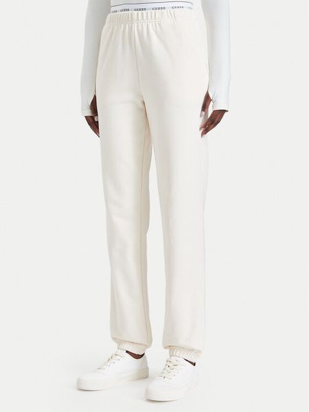 Guess Spodnie dresowe O5RB01 KCO31 Kremowy Regular Fit. Białe spodnie dresowe Guess, xl, z aplikacjami, z bawełny. Za 264.99 zł.