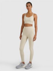 4F Legginsy treningowe bezszwowe damskie - beżowe M/L. Brązowe legginsy 4f, l, bez wzorów, z dzianiny, z podwyższonym stanem. Za 129.99 zł.