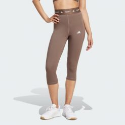 Legginsy capri TECHFIT. Brązowe legginsy Adidas, l, bez wzorów, z materiału. Za 179.00 zł.