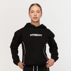 Bluza damska fitness z kapturem czarna Varsity. Czarne bluzy GYMBEAM, m, bez wzorów, z bawełny, z kapturem. Za 139.90 zł.