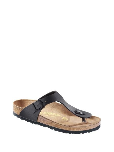 Birkenstock Skórzane japonki w kolorze czarnym rozmiar: 44. Czarne klapki Birkenstock, bez wzorów, z otwartym noskiem, bez obcasa. Za 264.45 zł.