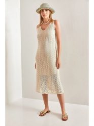 Bianco Lucci Sukienka dzianinowa w kolorze beżowym rozmiar: onesize. Brązowe sukienki Bianco Lucci, bez wzorów, z dzianiny, bez kołnierzyka, bez ramiączek, midi. Za 72.45 zł.