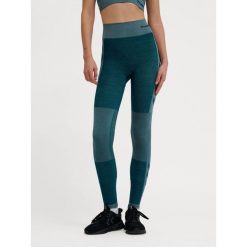 Damskie legginsy bezszwowe z wysokim stanem Hummel Clea. Niebieskie legginsy sportowe Hummel, bez wzorów, z materiału, z podwyższonym stanem, na fitness i siłownię. Za 170.00 zł.