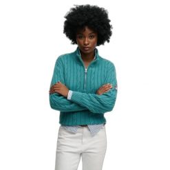 Damski pół-zamek sweter z warkoczowym splotem Superdry. Niebieskie swetry Superdry, na zimę, bez wzorów, ze splotem, bez ramiączek. Za 344.25 zł.