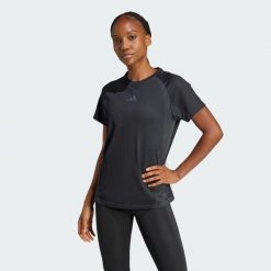 Bezszwowa koszulka z dzianiny. Czarne bluzki Adidas, bez wzorów, z dzianiny, sportowe, bez kołnierzyka, bez ramiączek. Za 199.00 zł.