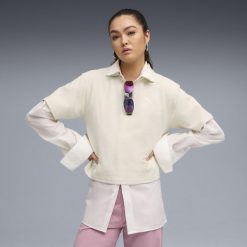 Damska koszulka polo PUMA Class o luźnym kroju PUMA Alpine Snow White. Białe koszulki polo Puma, bez wzorów, bez kołnierzyka, bez ramiączek. Za 129.00 zł.