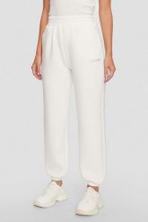 GUESS Dresowe damskie spodnie w kolorze ecru Cecilia Scuba. Brązowe spodnie dresowe Guess, s, z aplikacjami, z dresówki. W wyprzedaży za 319.99 zł.