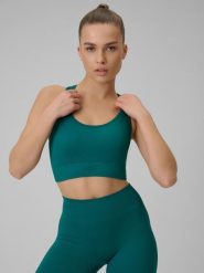 4F Biustonosz treningowy bezszwowy z niskim wsparciem damski - turkusowy XS/S. Niebieskie bielizna sportowa 4f, s, bez wzorów, z materiału. Za 89.99 zł.