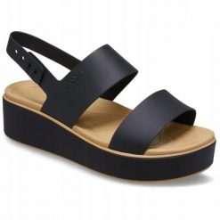 Sandały Dla Dorosłych Crocs Brooklyn Matte Wrap Low Wedge Sandal. Brązowe sandały Crocs, bez wzorów, z materiału, eleganckie, bez obcasa, na koturnie, bez zapięcia. Za 259.99 zł.