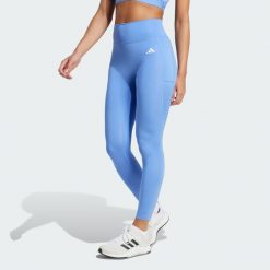 Legginsy 7/8 bez szwu z przodu Optime Essentials. Niebieskie legginsy Adidas, s, bez wzorów. Za 219.00 zł.