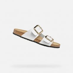 Damskie sandały Geox Brionia R B. Białe sandały Geox, bez wzorów, bez obcasa, bez zapięcia. Za 383.00 zł.