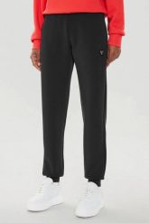 GUESS Czarne damskie spodnie dresowe Olympe. Czarne spodnie dresowe Guess, s, z aplikacjami, z dresówki. W wyprzedaży za 319.99 zł.