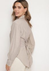 Ciemnobeżowa Koszula z Usztywnionymi Ramionami Ozdobiona Sznurkiem Meroriela. Brązowe koszule Born2be, uniwersalny, bez wzorów, z jeansu, eleganckie, bez kołnierzyka, bez ramiączek. Za 89.99 zł.