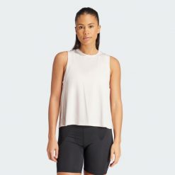 Koszulka Studio Tank. Fioletowe bluzki Adidas, uniwersalny, bez wzorów, z materiału, sportowe, bez kołnierzyka, bez ramiączek. Za 148.05 zł.